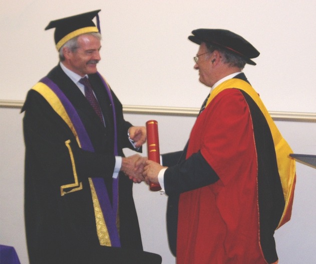 Dr Khan receives his award from UCL Provost Professor Malcolm Grant