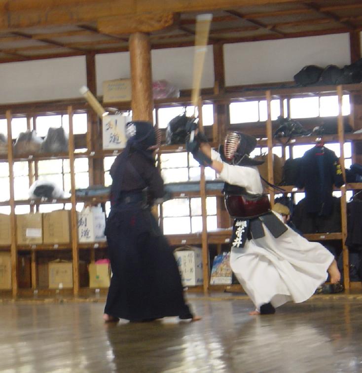 2 Japanese girls fighting with sticks